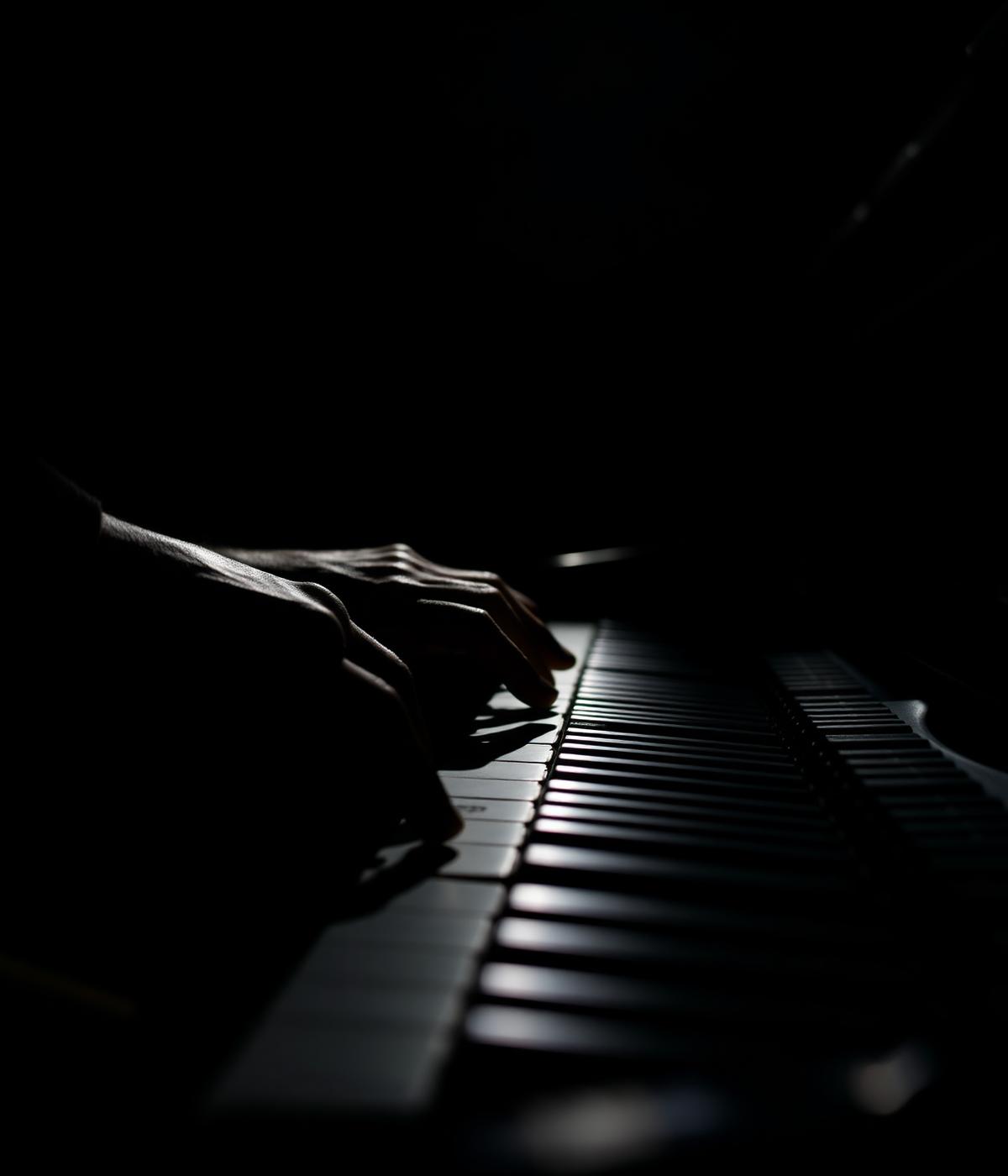 Hands playing piano